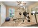 View of the exercise room including weight machine, treadmill, exercise ball, window and closet at 11602 Graces Way, Clermont, FL 34711