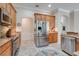 Well-equipped kitchen features stainless steel appliances and granite countertops at 11602 Graces Way, Clermont, FL 34711