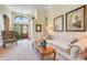Bright living room with hardwood floors, neutral decor, and lots of natural light at 11602 Graces Way, Clermont, FL 34711