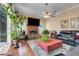 Bright and airy living room featuring a large window and hardwood floors at 11602 Graces Way, Clermont, FL 34711