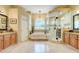 Luxurious main bathroom with dual vanities, a soaking tub, and a glass-enclosed shower at 11602 Graces Way, Clermont, FL 34711