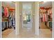 Dual walk-in closets lead into the main bedroom at 11602 Graces Way, Clermont, FL 34711