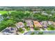 Aerial view of upscale neighborhood with manicured lawns and mature trees close to a large park at 1365 Tappie Toorie Cir, Lake Mary, FL 32746