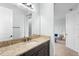 Bathroom vanity features granite countertop, dark wood cabinetry, and neutral paint at 1365 Tappie Toorie Cir, Lake Mary, FL 32746