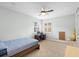 Bright bedroom featuring a ceiling fan, natural light, and a built-in desk area for study at 1365 Tappie Toorie Cir, Lake Mary, FL 32746