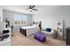 Comfortable bedroom features shutters, neutral paint, ceiling fan and stylish decor at 1365 Tappie Toorie Cir, Lake Mary, FL 32746