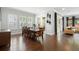 Spacious dining room features a large table, hardwood floors, and views of the backyard at 1365 Tappie Toorie Cir, Lake Mary, FL 32746