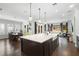 Open-concept kitchen with island, stainless appliances and eat-in kitchen dining area and backyard views at 1365 Tappie Toorie Cir, Lake Mary, FL 32746