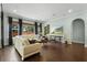 Bright living room with hardwood floors, natural light and comfortable seating at 1365 Tappie Toorie Cir, Lake Mary, FL 32746