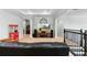 Spacious living area featuring a large TV, surround sound, and a classic Coca-Cola popcorn machine at 1365 Tappie Toorie Cir, Lake Mary, FL 32746