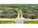 Aerial view of the community showcasing tree-lined streets, well-maintained landscaping, and residential buildings at 14231 Desert Haven St # Ge, Windermere, FL 34786