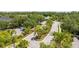Community entrance with lush landscaping, a gate, and a well-maintained roadway at 14231 Desert Haven St # Ge, Windermere, FL 34786