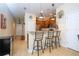 Eat-in kitchen featuring stainless steel appliances, bar seating and stylish pendant lighting at 14231 Desert Haven St # Ge, Windermere, FL 34786