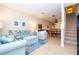Bright living room with stylish furniture and open staircase to the upper level at 14231 Desert Haven St # Ge, Windermere, FL 34786