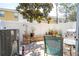 Outdoor patio area with landscaping, white privacy fence, seating, and a grill at 14231 Desert Haven St # Ge, Windermere, FL 34786