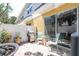 Outdoor patio area with landscaping, white privacy fence, seating, and a grill at 14231 Desert Haven St # Ge, Windermere, FL 34786