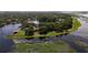 Beautiful waterfront property with lush green landscaping, dock access, and amazing water views at 1425 Riviera Dr, Kissimmee, FL 34744