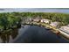 Picturesque aerial view of luxurious waterfront homes, docks, boat lifts, and stunning lakefront scenery at 1425 Riviera Dr, Kissimmee, FL 34744
