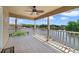 Balcony with tile floors and a white railing overlooking the beautiful lake at 1425 Riviera Dr, Kissimmee, FL 34744