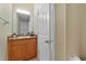 This bathroom has a single sink vanity and a toilet at 1425 Riviera Dr, Kissimmee, FL 34744