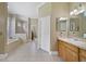 Large bathroom features a soaking tub and separate shower at 1425 Riviera Dr, Kissimmee, FL 34744