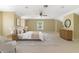 Bright bedroom offers neutral carpet, ceiling fan and simple decor at 1425 Riviera Dr, Kissimmee, FL 34744