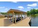 Covered boat dock with boat lift, providing easy access to the lake at 1425 Riviera Dr, Kissimmee, FL 34744