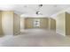 Spacious bonus room with neutral carpet and paint and a ceiling fan at 1425 Riviera Dr, Kissimmee, FL 34744