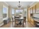 Cozy breakfast nook surrounded by natural light from the large windows, offering beautiful backyard views at 1425 Riviera Dr, Kissimmee, FL 34744