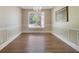 A formal dining room featuring wood floors, chandelier, and decorative molding at 1425 Riviera Dr, Kissimmee, FL 34744