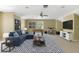 This entertainment room features ample seating, a game table, and tv at 1425 Riviera Dr, Kissimmee, FL 34744