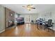 Spacious room with fireplace, hardwood floors, ceiling fan, and plenty of natural light at 1425 Riviera Dr, Kissimmee, FL 34744