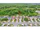 Aerial view of a single-Gathering home featuring a well-maintained yard and mature trees surrounding the property at 1429 Carey Glen Cir, Orlando, FL 32824