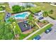 Overhead view of community amenities, including a swimming pool and playground. Lush landscaping at 1429 Carey Glen Cir, Orlando, FL 32824