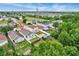 Aerial view features a fenced backyard with a patio and shed, surrounded by lush trees, and near neighborhood amenities at 1429 Carey Glen Cir, Orlando, FL 32824