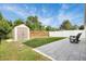 Spacious backyard with privacy fence, patio area, shed, and green grass at 1429 Carey Glen Cir, Orlando, FL 32824