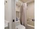 Bathroom featuring a tub and shower combination with neutral-colored tile and fixtures at 1429 Carey Glen Cir, Orlando, FL 32824