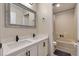 Modern bathroom featuring double sinks, white cabinets, and a combined tub and shower at 1429 Carey Glen Cir, Orlando, FL 32824