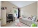 Cozy bedroom with a desk, decorated with personal touches, and ample natural light at 1429 Carey Glen Cir, Orlando, FL 32824