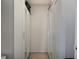 View of the closet with white doors and mirror inserts, with storage areas above at 1429 Carey Glen Cir, Orlando, FL 32824
