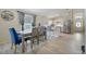 Dining area with table and chairs located next to a breakfast bar and kitchen at 1429 Carey Glen Cir, Orlando, FL 32824