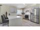 Stylish kitchen boasting stainless steel appliances, quartz countertops, and ample cabinet space at 1429 Carey Glen Cir, Orlando, FL 32824