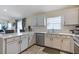Well-lit kitchen features modern appliances, ample counter space, and seamless flow to the dining area at 1429 Carey Glen Cir, Orlando, FL 32824