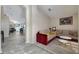 Open-concept living room with tile floors and seamless flow to dining area, perfect for entertaining at 1429 Carey Glen Cir, Orlando, FL 32824