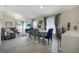 Bright open-concept living and dining area with stylish decor and modern flooring at 1429 Carey Glen Cir, Orlando, FL 32824