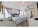 Main bedroom with a ceiling fan, sliding frosted-glass door and neutral decor at 1429 Carey Glen Cir, Orlando, FL 32824