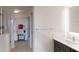 Bright bathroom featuring a large vanity, glass shower, and walk-in closet with an organized shelving system at 14501 Grove Resort Ave # 2440, Winter Garden, FL 34787