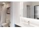 Modern bathroom featuring a sleek vanity, a backlit mirror, and a walk-in shower at 14501 Grove Resort Ave # 2440, Winter Garden, FL 34787