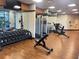 Bright gym featuring modern equipment, free weights, fitness machines, and hardwood floors at 14501 Grove Resort Ave # 2440, Winter Garden, FL 34787