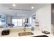 Stylish kitchen with stainless steel sink, and a view of the modern living and dining area at 14501 Grove Resort Ave # 2440, Winter Garden, FL 34787